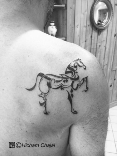 Minimalistic black horse temporary tattoo located on